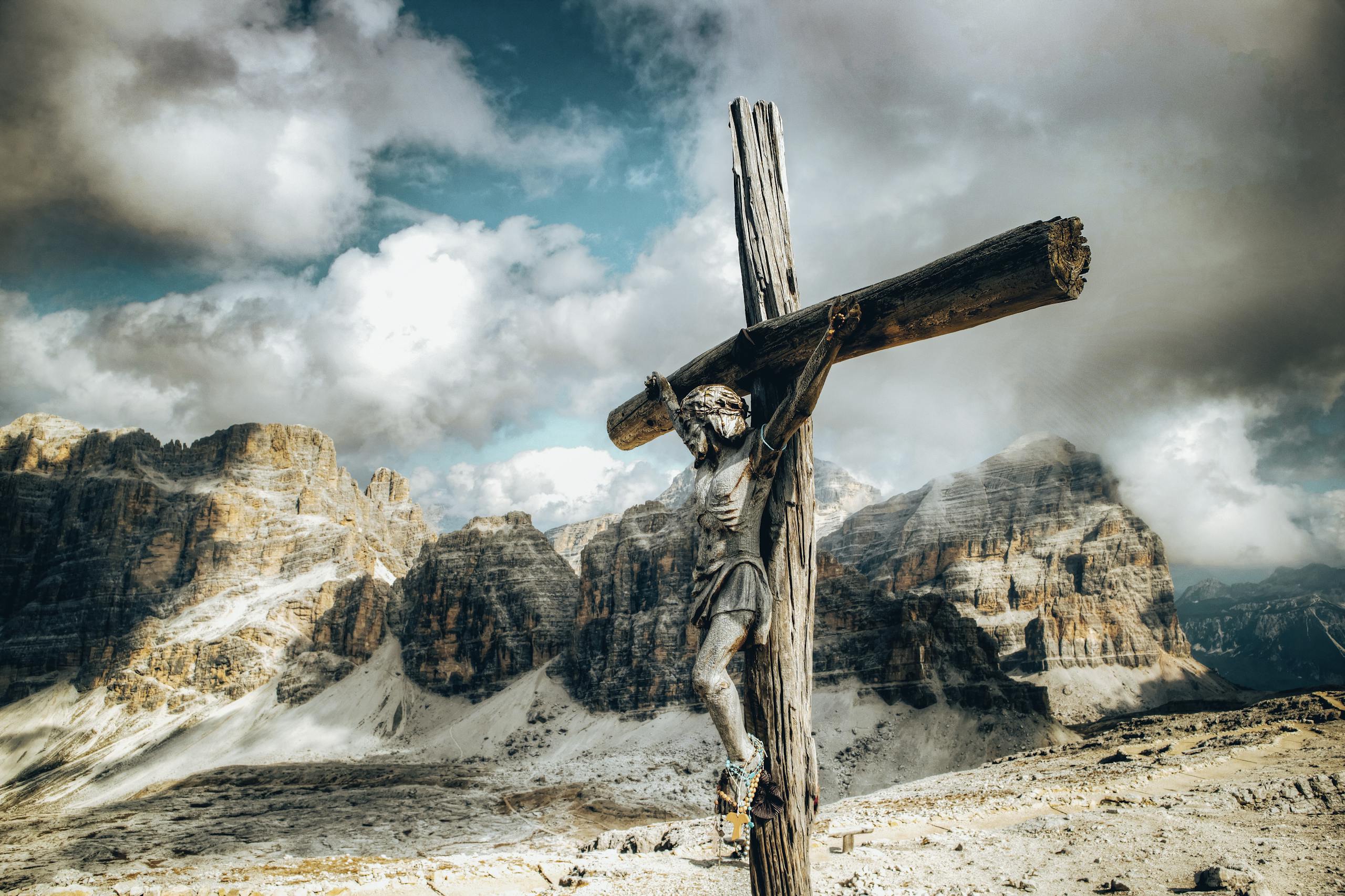 A Wooden Crucifix Against the Rock Mountains