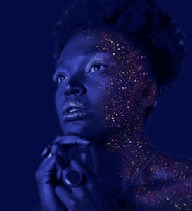 Fashion Photography of Woman Hands on Chin With Glitter Makeup