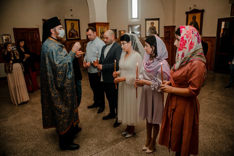 Priest Blessing People in Church